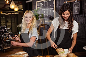 Pretty waitresses behind the counter working