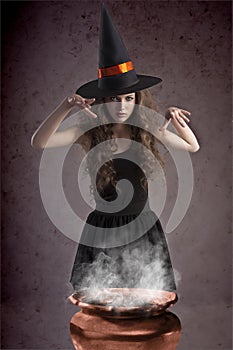 Pretty witch making some spells