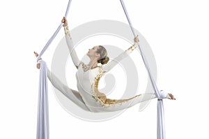 Pretty woman - aerialist performing aerial tricks on aerial silks.