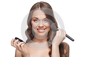 Pretty woman applying makeup