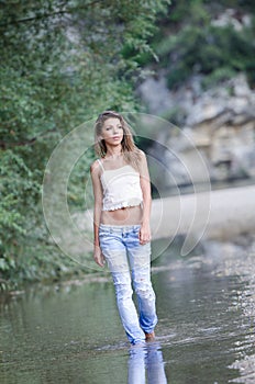 Pretty woman in the beautiful scenery at the river