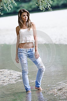 Pretty woman in the beautiful scenery at the river