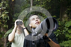 Pretty Woman with Binoculars and Man with Telescop