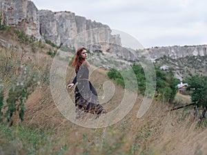 pretty woman black dress walk mountain travel