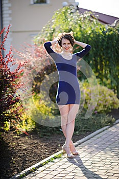 pretty woman in a blue dress outdoor