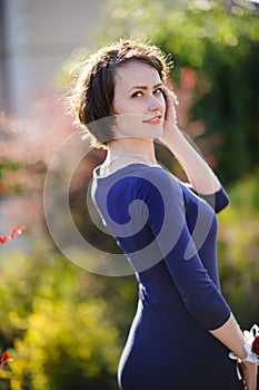 pretty woman in a blue dress outdoor