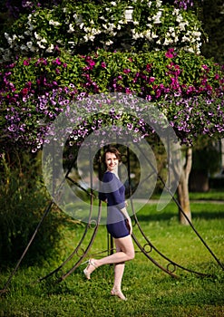 pretty woman in a blue dress outdoor