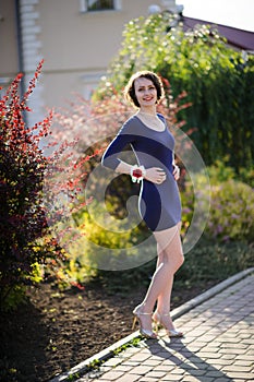 pretty woman in a blue dress outdoor