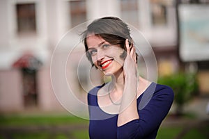 pretty woman in a blue dress outdoor