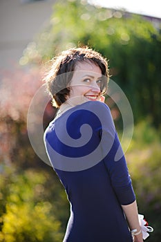 pretty woman in a blue dress outdoor