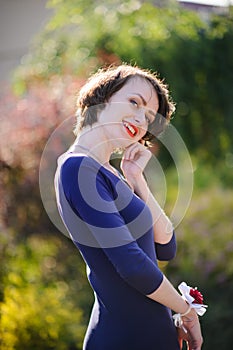 pretty woman in a blue dress outdoor