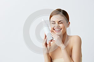 pretty woman body lotion rejuvenation cosmetics Gray background