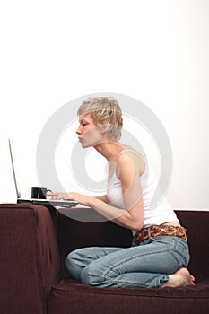 Pretty woman checking message on her laptop 1