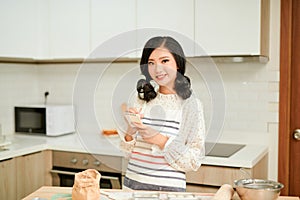 Pretty woman checking recipe on line