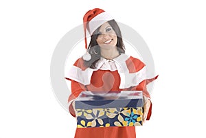 A pretty woman at Christmas holding a gift box