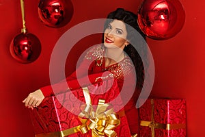 Pretty woman with christmas red gift box