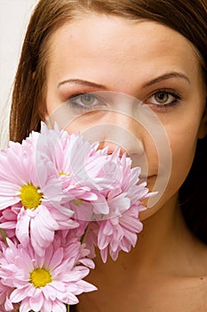 Pretty woman with daisies