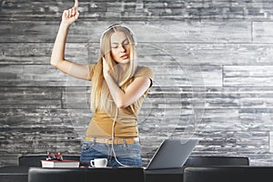 Pretty woman DJ ing at workplace photo
