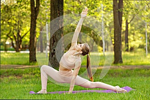 Pretty woman doing yoga exercises. Portrait of woman in sportswear