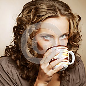 Pretty woman drinking coffee
