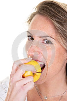 Pretty woman eating bitting fresh apple