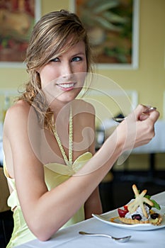 Pretty Woman Eating Dessert at Nice Restaurant