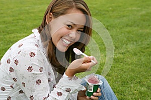 Pretty Woman Eating Yogurt