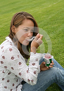 Pretty Woman Eating Yogurt