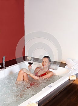 Pretty woman enjoying bubble bath