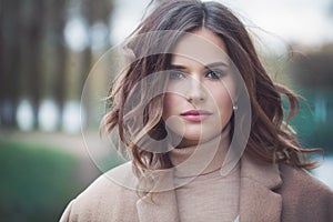 Pretty Woman Fashion Model with Blowing Curly Hair