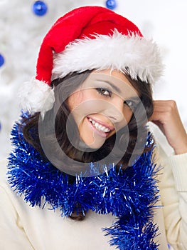 Pretty woman in a festive red Santa Hat