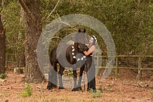 Pretty woman with Frisian horse