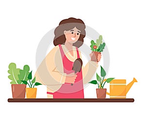 Pretty woman or gardener taking care of plants and flowers