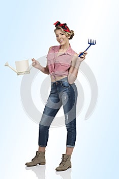 Pretty woman with gardening tools