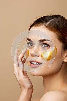 pretty woman golden patches on the face  background