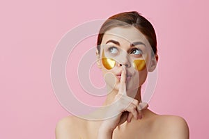 pretty woman golden patches on the face  background