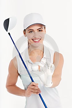 Pretty woman golfer on white background in studio