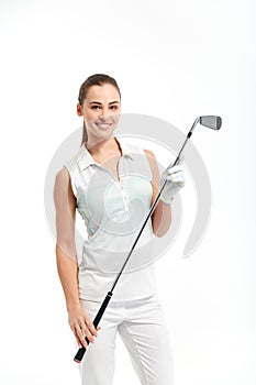 Pretty woman golfer on white background in studio