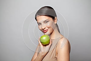 Pretty woman with green apple fruit. Diet and healthy food concept