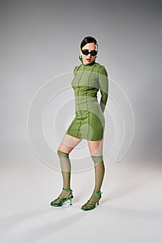 Pretty woman in green mini dress