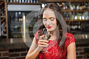 Pretty woman having a glass of wine