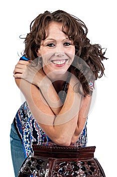 Pretty woman with her elbows resting on a small table