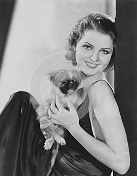 Pretty woman with her pekingese puppy