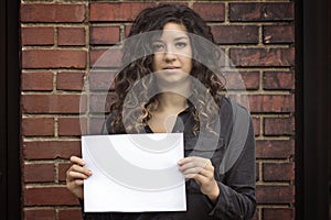 Pretty Woman Holding Blank Sign or Paper