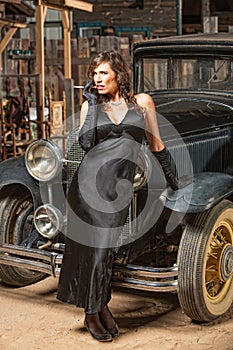 Pretty Woman Leaning on Car