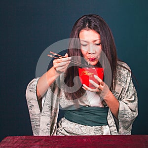 Pretty woman with long hair eating asian noodles, traditional food, style, beautiful colors