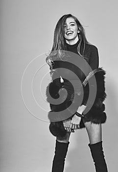 Pretty woman with long hair in fur and jackboot