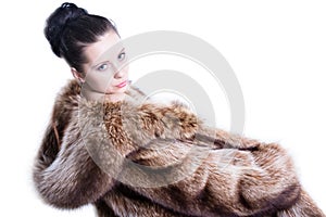 Pretty woman in luxury winter fur coat