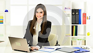 Pretty woman notary at work laptop. Bank worker. Business challenges. Licensed notary. Notaries and notary signing photo