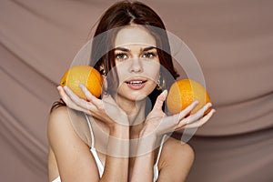 pretty woman with oranges fruit beauty fashion studio